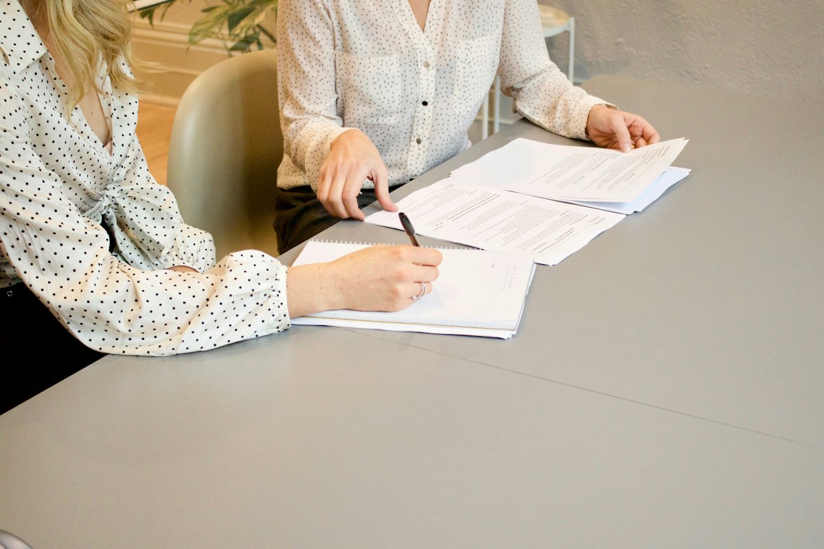 A client and preparer going over IRS paperwork